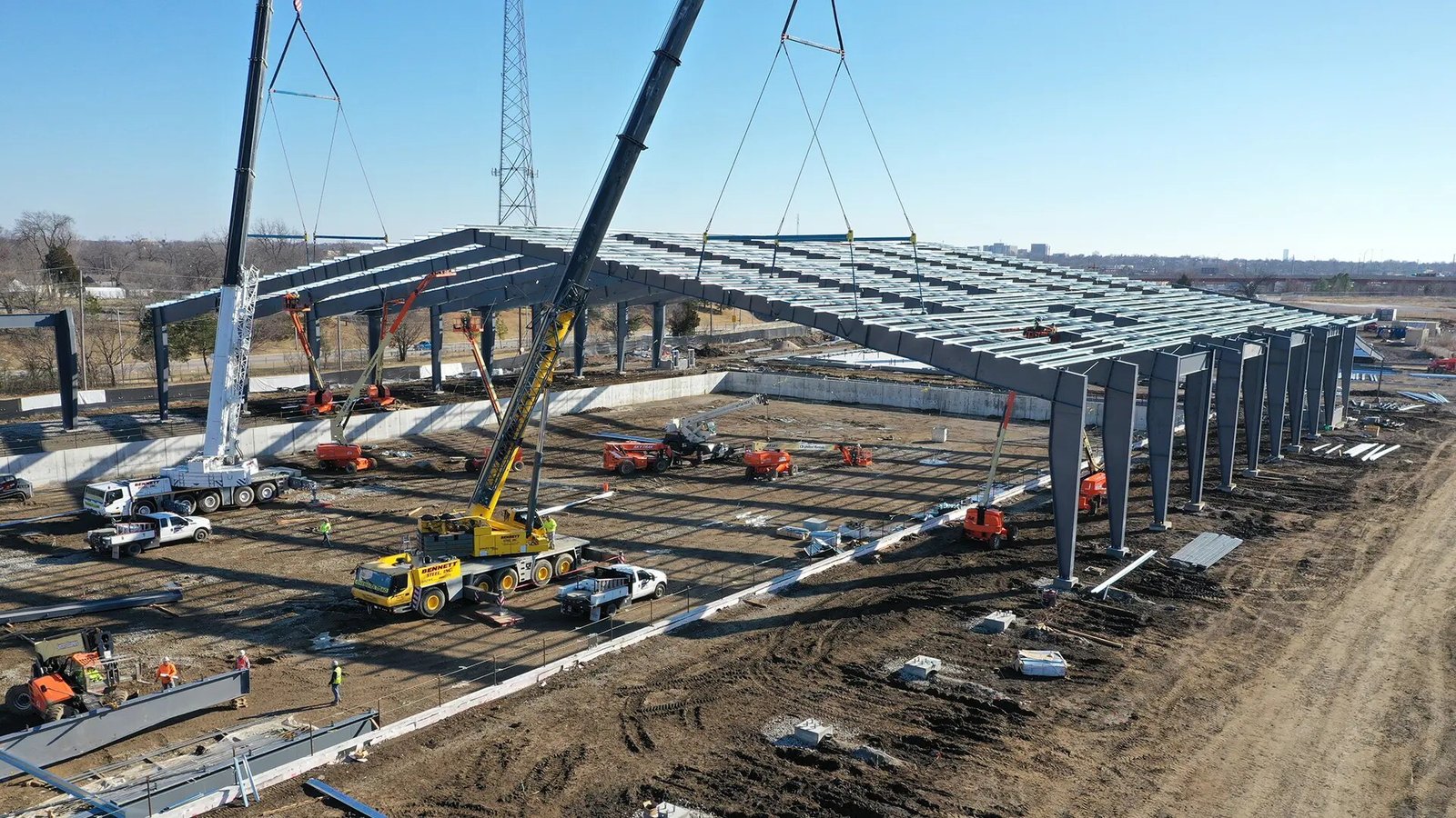 Crane lifting a steel roof assembly at the Highgate Industrial Complex